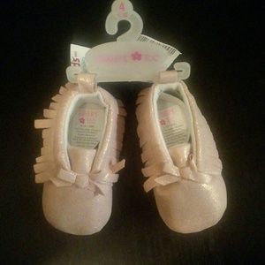 Pink and gold moccasins